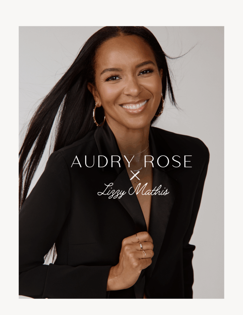 alt="Audry Rose Lizzy Mathis campaign hero portrait with gold hoops, layered necklaces, and delicate rings"